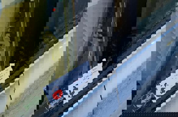 Car lockout service unlocking vehicle door for customer by automotive locksmith.